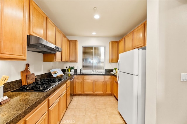 4025 Canario St Unit 142, Carlsbad, CA 92008 - kitchen with freestanding refrigerator, under cabinet range hood, black gas stovetop, tile countertops, and stainless steel dishwasher