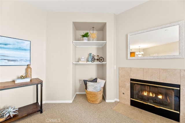 4025 Canario St Unit 142, Carlsbad, CA 92008 - detailed view of a tiled fireplace, carpet, and a chandelier