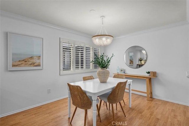 1201 S Catalina Ave Unit 3A, Redondo Beach, CA 90277 - dining area featuring a chandelier, wood finished floors, and crown molding