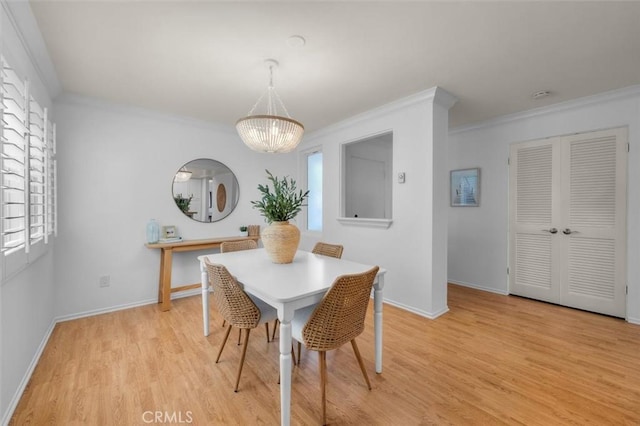 1201 S Catalina Ave Unit 3A, Redondo Beach, CA 90277 - dining room featuring ornamental molding, a chandelier, and light wood-style floors