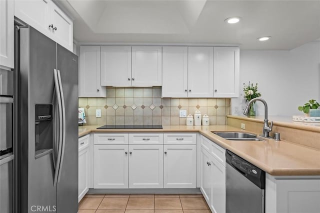 1201 S Catalina Ave Unit 3A, Redondo Beach, CA 90277 - kitchen with stainless steel appliances, white cabinets, recessed lighting, light tile patterned floors, and decorative backsplash