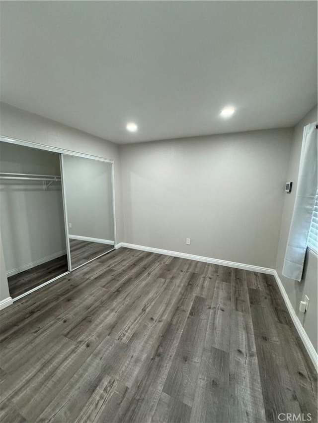 1025 N Tippecanoe Ave Unit 132, San Bernardino, CA 92410 - unfurnished bedroom featuring wood finished floors, a closet, and recessed lighting
