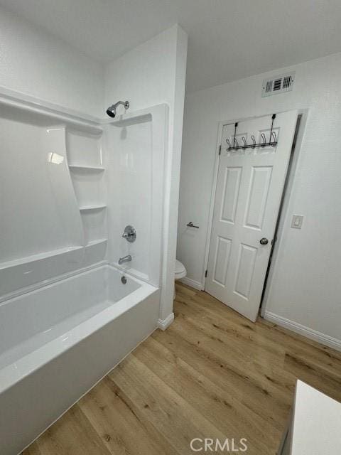 1025 N Tippecanoe Ave Unit 132, San Bernardino, CA 92410 - bathroom featuring wood finished floors and shower / tub combination