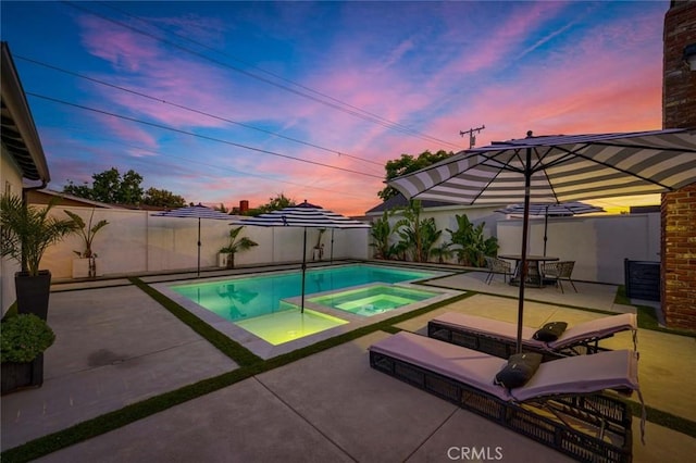 1402 E Rose Ave, Orange, CA 92867 - pool at dusk featuring a patio and a fenced backyard