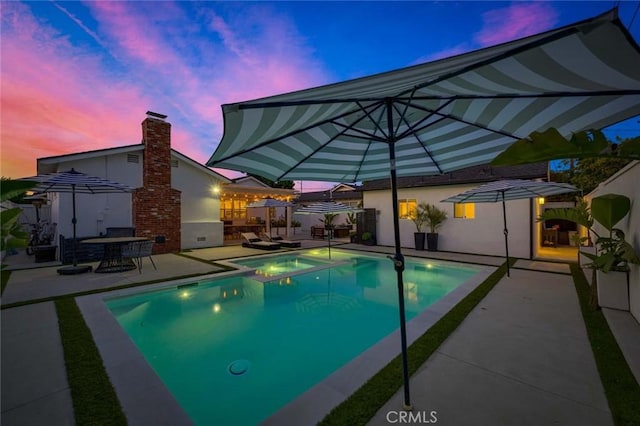 1402 E Rose Ave, Orange, CA 92867 - pool at dusk featuring a patio area and a pool with connected hot tub