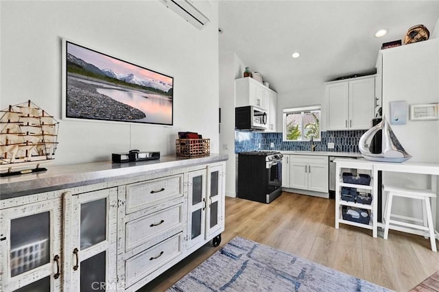 1402 E Rose Ave, Orange, CA 92867 - bar area with gas range, stainless steel microwave, decorative backsplash, light wood finished floors, and recessed lighting