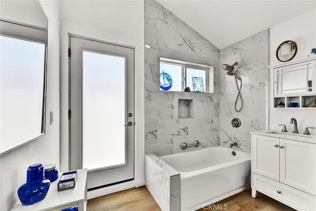 1402 E Rose Ave, Orange, CA 92867 - full bath featuring vaulted ceiling, vanity, bathing tub / shower combination, and wood finished floors