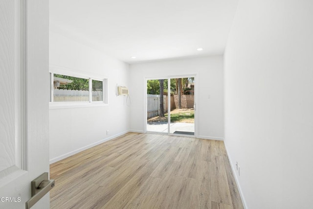 341 1st St, Fillmore, CA 93015 - unfurnished room featuring light wood-style floors, recessed lighting, and a wall unit AC