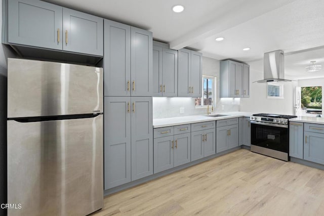 341 1st St, Fillmore, CA 93015 - kitchen with stainless steel appliances, exhaust hood, gray cabinets, light wood-type flooring, and recessed lighting