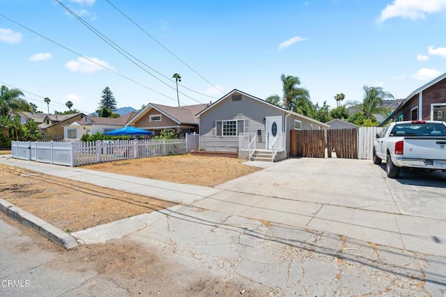 341 1st St, Fillmore, CA 93015 - view of front of property featuring a fenced front yard and concrete driveway