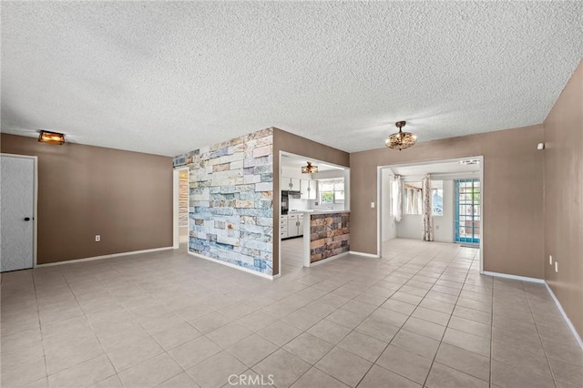 25869 Sandy Lodge Rd, Menifee, CA 92586 - unfurnished living room with a textured ceiling, tile patterned floors, and a chandelier