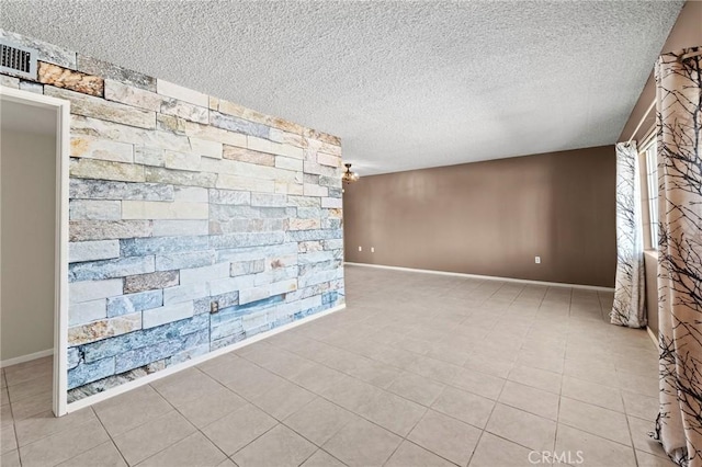 25869 Sandy Lodge Rd, Menifee, CA 92586 - unfurnished room with a textured ceiling, an accent wall, and tile patterned flooring