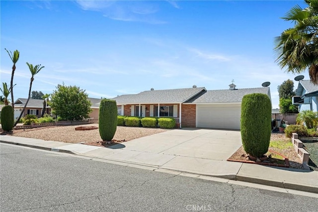 25869 Sandy Lodge Rd, Menifee, CA 92586 - ranch-style house with a garage, concrete driveway, and brick siding
