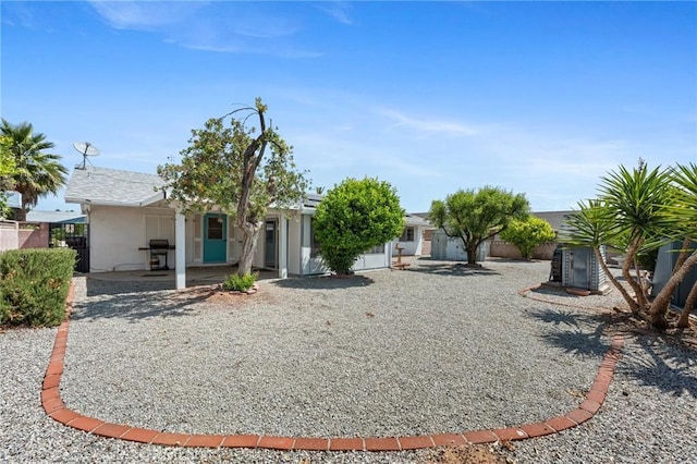 25869 Sandy Lodge Rd, Menifee, CA 92586 - view of front of house featuring stucco siding and a patio area