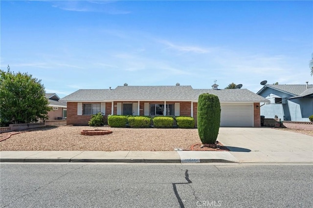 25869 Sandy Lodge Rd, Menifee, CA 92586 - ranch-style house featuring driveway, a garage, and brick siding