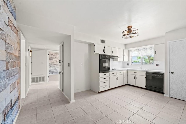 25869 Sandy Lodge Rd, Menifee, CA 92586 - kitchen featuring black appliances, white cabinetry, light tile patterned floors, under cabinet range hood, and light countertops
