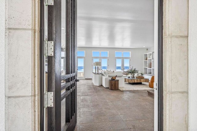 1716 Ocean Front, Del Mar, CA 92014 - living area featuring stone tile flooring and a water view