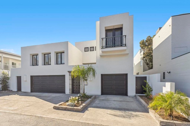 1716 Ocean Front, Del Mar, CA 92014 - view of front of property with a balcony, a garage, stucco siding, and driveway