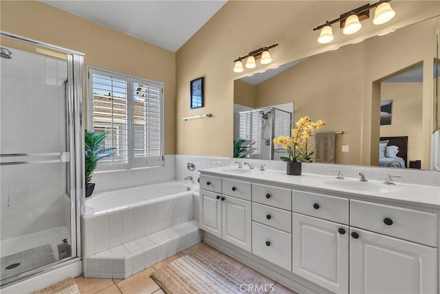 565 N Pageant Dr Unit B, Orange, CA 92869 - bathroom featuring double vanity, a stall shower, a garden tub, and tile patterned floors