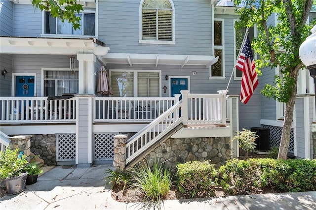565 N Pageant Dr Unit B, Orange, CA 92869 - property entrance featuring covered porch and stone siding