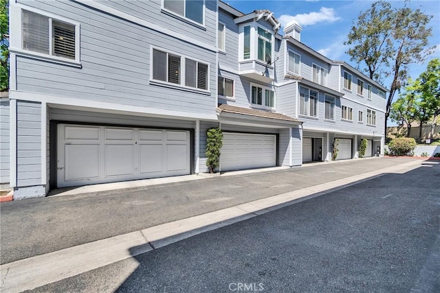 565 N Pageant Dr Unit B, Orange, CA 92869 - exterior space featuring an attached garage