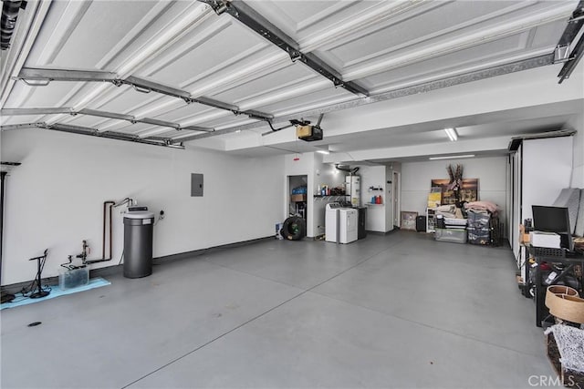 565 N Pageant Dr Unit B, Orange, CA 92869 - garage with a garage door opener, electric panel, and washing machine and clothes dryer
