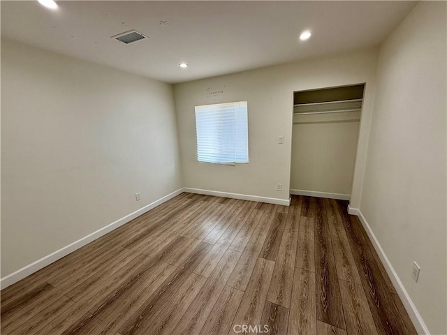 236 S 5th St, Montebello, CA 90640 - unfurnished bedroom with wood finished floors, recessed lighting, and a closet