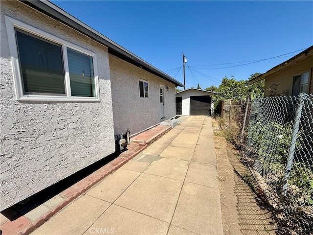 236 S 5th St, Montebello, CA 90640 - view of side of home with stucco siding and an outdoor structure