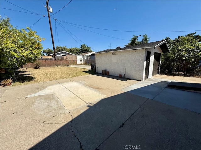 236 S 5th St, Montebello, CA 90640 - rear view of property featuring stucco siding, an outdoor structure, and a patio area