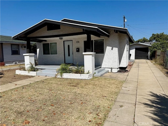 236 S 5th St, Montebello, CA 90640 - bungalow with stucco siding, covered porch, and a garage