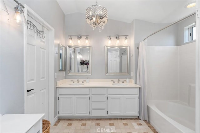 34 Key Largo, Aliso Viejo, CA 92656 - bathroom with shower / bath combination with curtain, double vanity, vaulted ceiling, and a chandelier