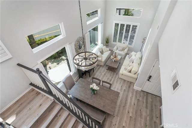 34 Key Largo, Aliso Viejo, CA 92656 - living area with a high ceiling, wood finished floors, and stairs