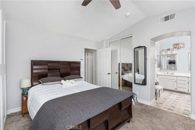34 Key Largo, Aliso Viejo, CA 92656 - bedroom with vaulted ceiling, light carpet, a closet, ensuite bath, and a ceiling fan