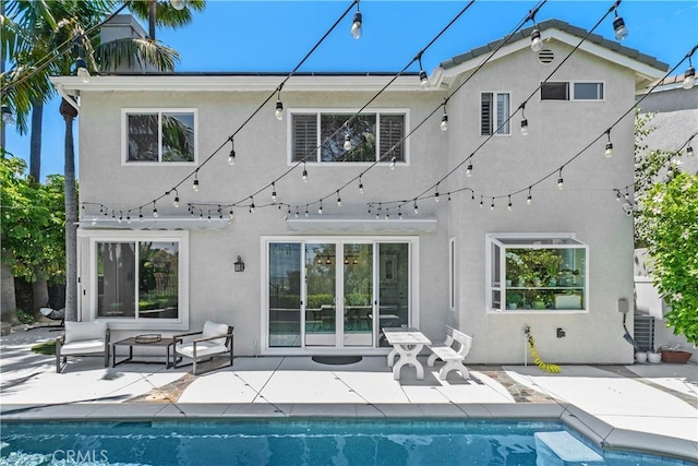 34 Key Largo, Aliso Viejo, CA 92656 - back of house with stucco siding, a patio, and an outdoor pool