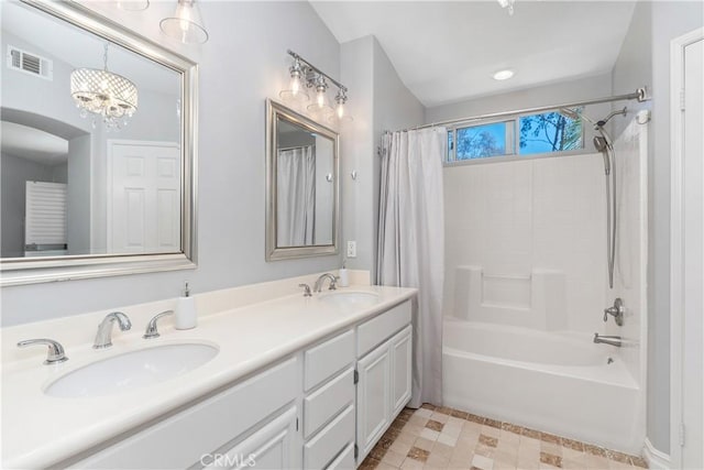 34 Key Largo, Aliso Viejo, CA 92656 - bathroom with shower / bathtub combination with curtain, double vanity, and a chandelier
