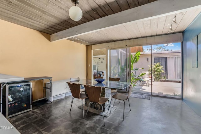 1412 Ellsworth Ct, Thousand Oaks, CA 91360 - dining room featuring concrete floors, beverage cooler, and a wooden ceiling with exposed beams