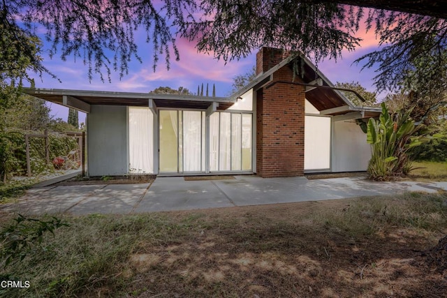 1412 Ellsworth Ct, Thousand Oaks, CA 91360 - view of front of house featuring a chimney and a patio