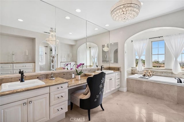 17 Lemans, Newport Coast, CA 92657 - full bathroom with double vanity, a bath, recessed lighting, tile patterned flooring, and a chandelier