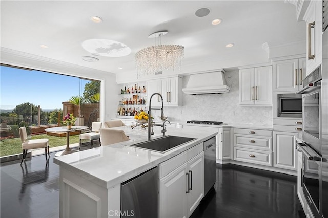 17 Lemans, Newport Coast, CA 92657 - kitchen featuring custom exhaust hood, decorative backsplash, light countertops, white cabinetry, and recessed lighting