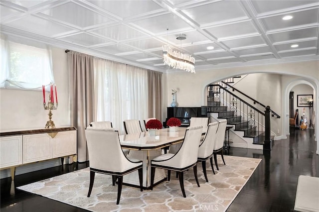 17 Lemans, Newport Coast, CA 92657 - dining space with arched walkways, stairs, wood finished floors, a chandelier, and coffered ceiling