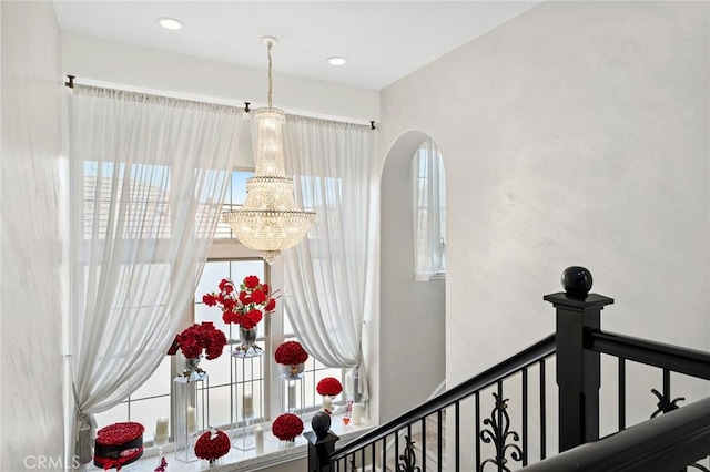 17 Lemans, Newport Coast, CA 92657 - stairs featuring a chandelier and arched walkways