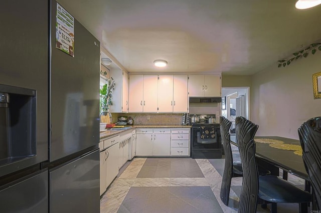 320 W 8th Ave, Escondido, CA 92025 - kitchen featuring black range with electric stovetop, white cabinetry, under cabinet range hood, and tasteful backsplash