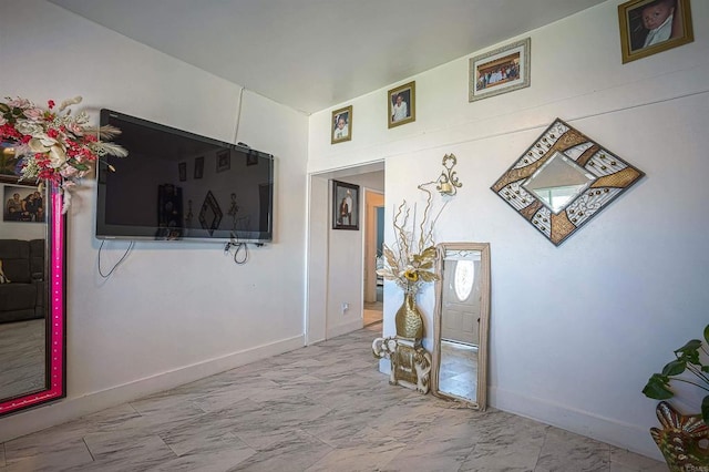 320 W 8th Ave, Escondido, CA 92025 - corridor featuring marble look tiles and baseboards