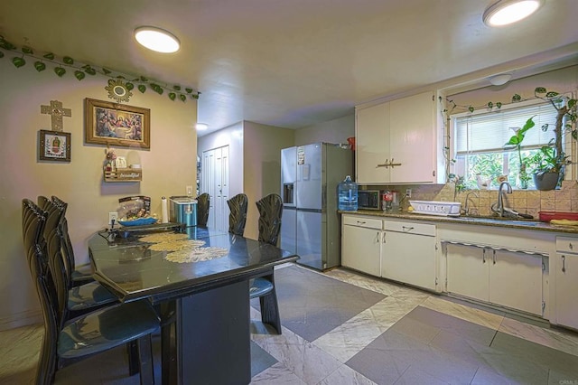 320 W 8th Ave, Escondido, CA 92025 - kitchen with fridge with ice dispenser, white cabinets, and tasteful backsplash
