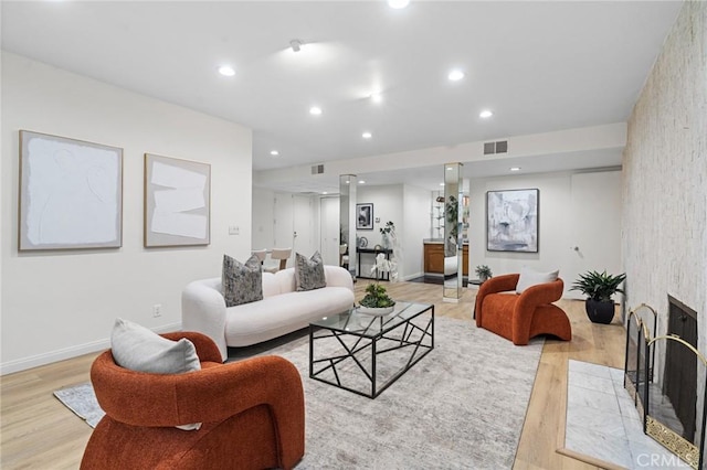 1277 S Beverly Glen Blvd Unit 205, Los Angeles, CA 90024 - living area featuring light wood-style floors, a fireplace, and recessed lighting