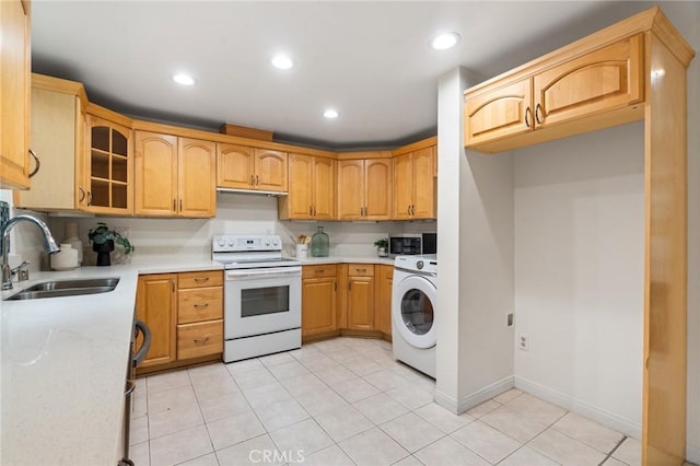 1277 S Beverly Glen Blvd Unit 205, Los Angeles, CA 90024 - kitchen featuring white range with electric stovetop, washer / clothes dryer, glass insert cabinets, light tile patterned floors, and recessed lighting