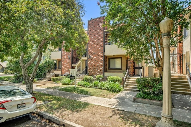 1207 N Columbus Ave, Glendale, CA 91202 - townhome / multi-family property with stairs and brick siding