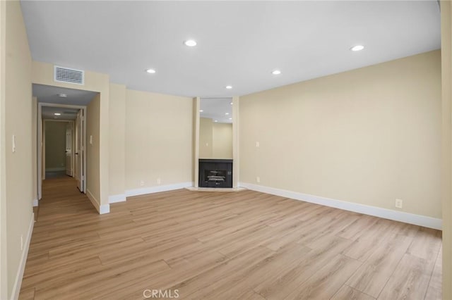 1207 N Columbus Ave, Glendale, CA 91202 - unfurnished living room with light wood-type flooring, a fireplace with flush hearth, and recessed lighting