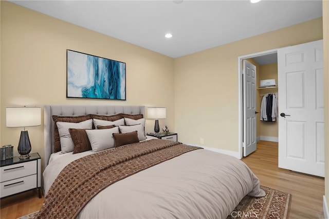1207 N Columbus Ave, Glendale, CA 91202 - bedroom with light wood finished floors, recessed lighting, a spacious closet, and a closet