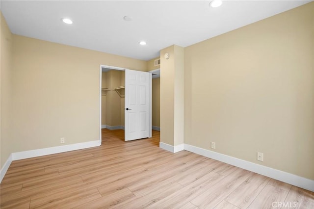 1207 N Columbus Ave, Glendale, CA 91202 - unfurnished bedroom featuring light wood-style floors, recessed lighting, a closet, and a spacious closet